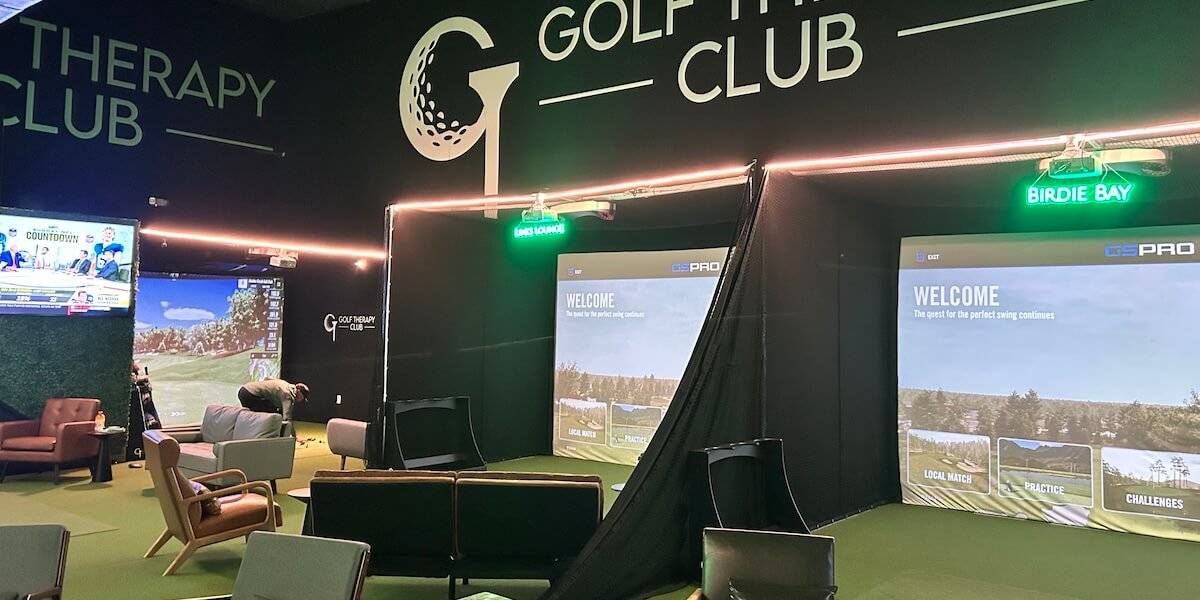 Simulator bays and lounge seating at Golf Therapy Club in Sarasota