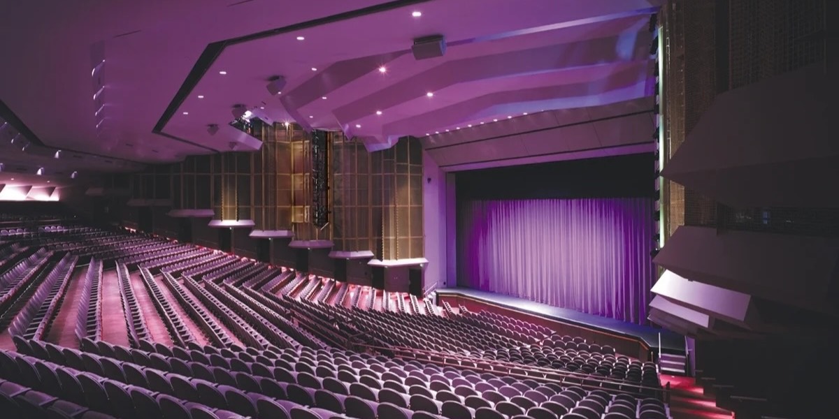 Inside the Van Wezel Performing Arts Hall auditorium with its purple-lit stage
